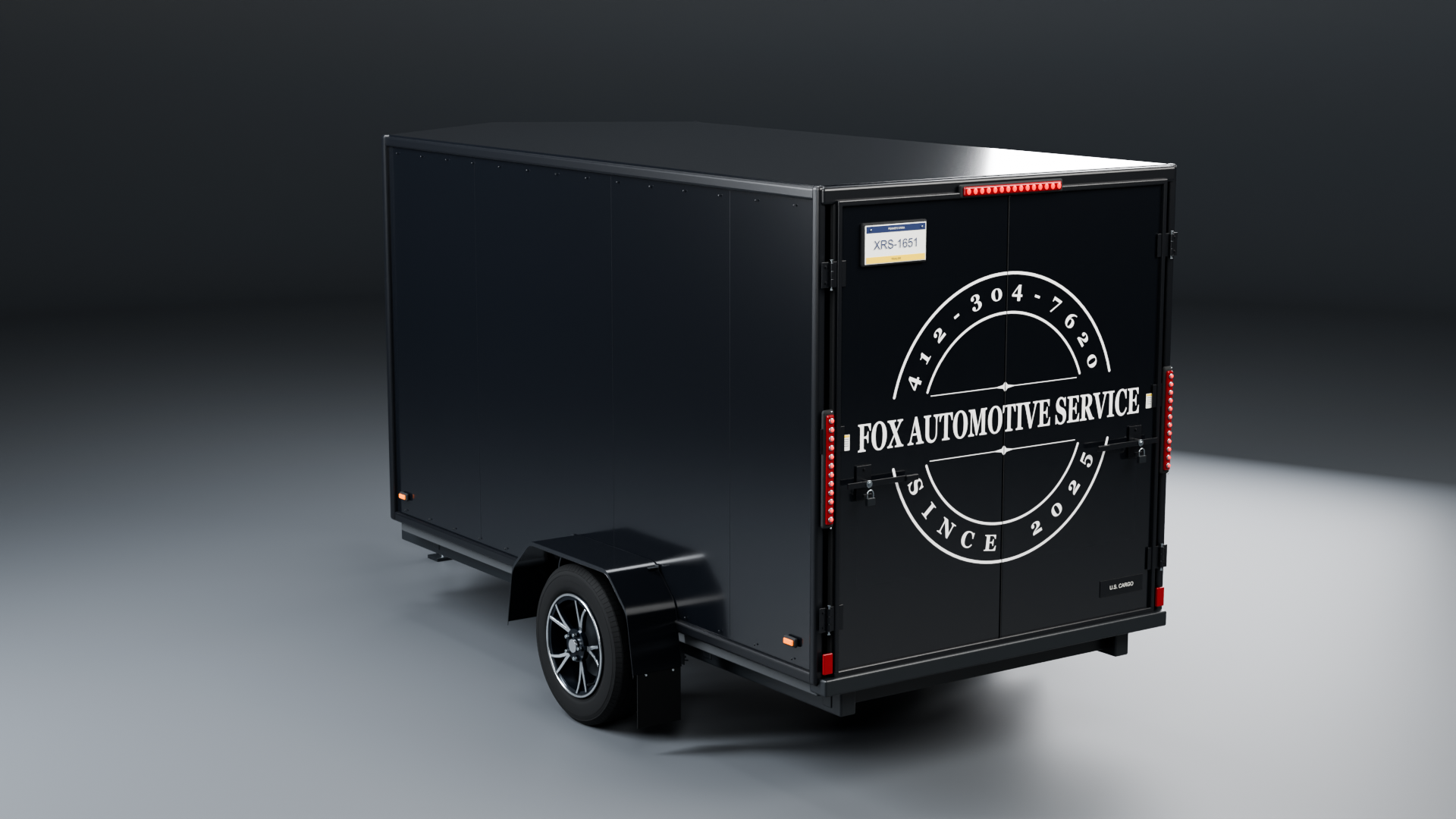 3D render of the black Fox Automotive mobile workshop trailer with its white business logo